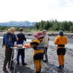 Rafters and guides eating lunch in Alaska - McCarthy River Tours
